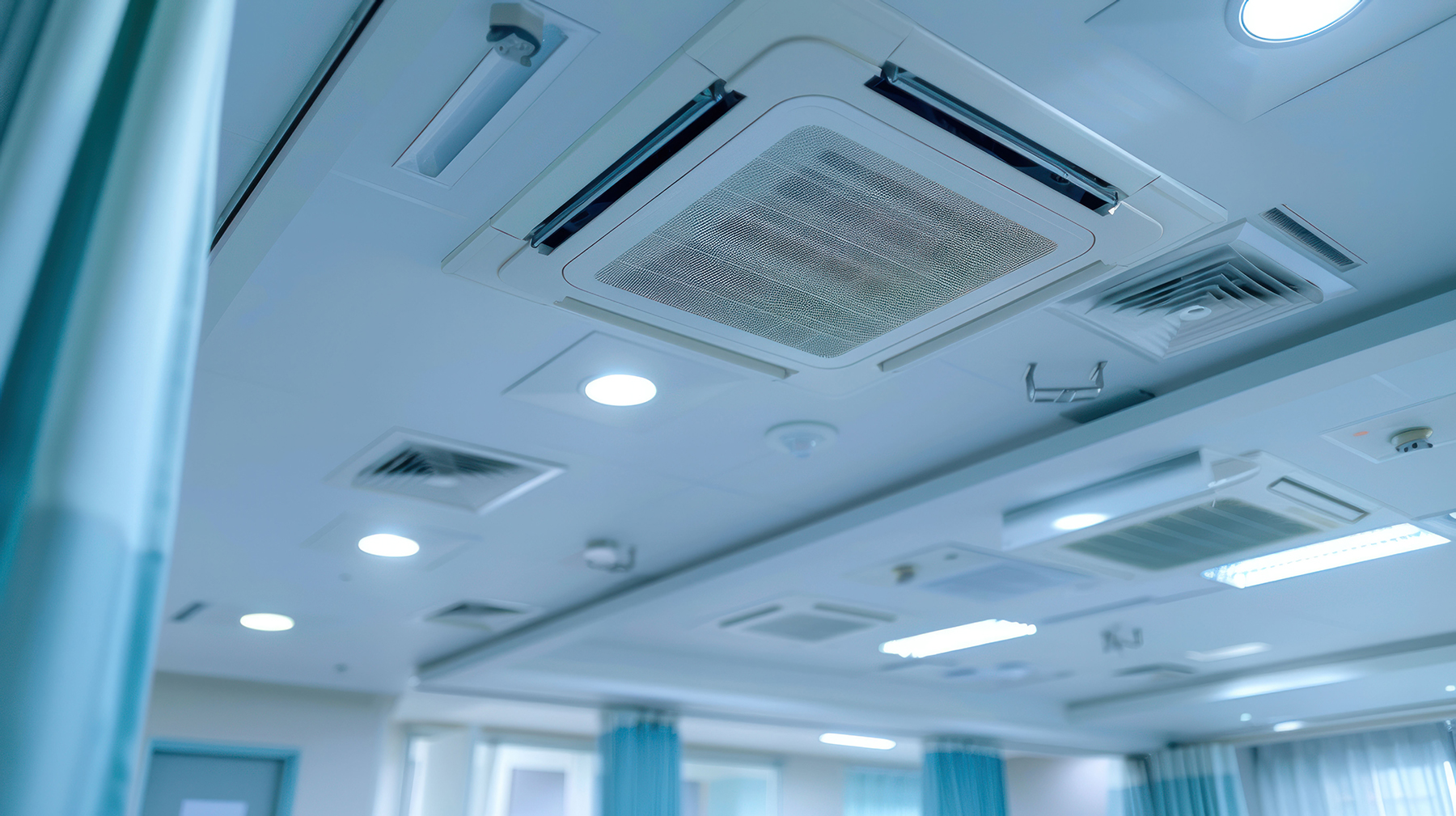 Modern hospital ceiling with air conditioning and lighting fixtures, showcasing clean and sterile environment. design emphasises functionality and comfort for patients
